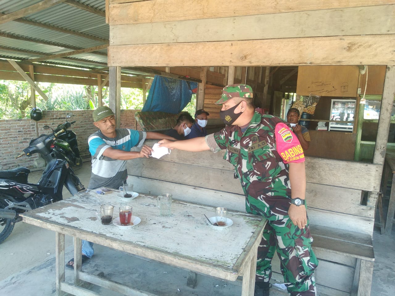 Babinsa Koramil 02 Bukit Kapur -Kodim 0320/Dumai, Kelurahan Bagan Besar Kecamatan Bukit Kapur, Serma Zul Ependi Melaksanakan Sosialisasi Pencegahan Covid-19